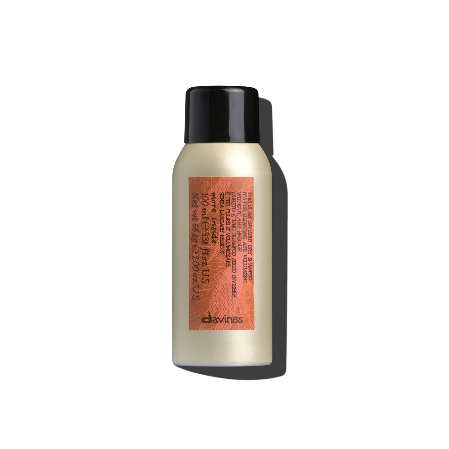 Hair product bottle with black cap and orange label on a white background