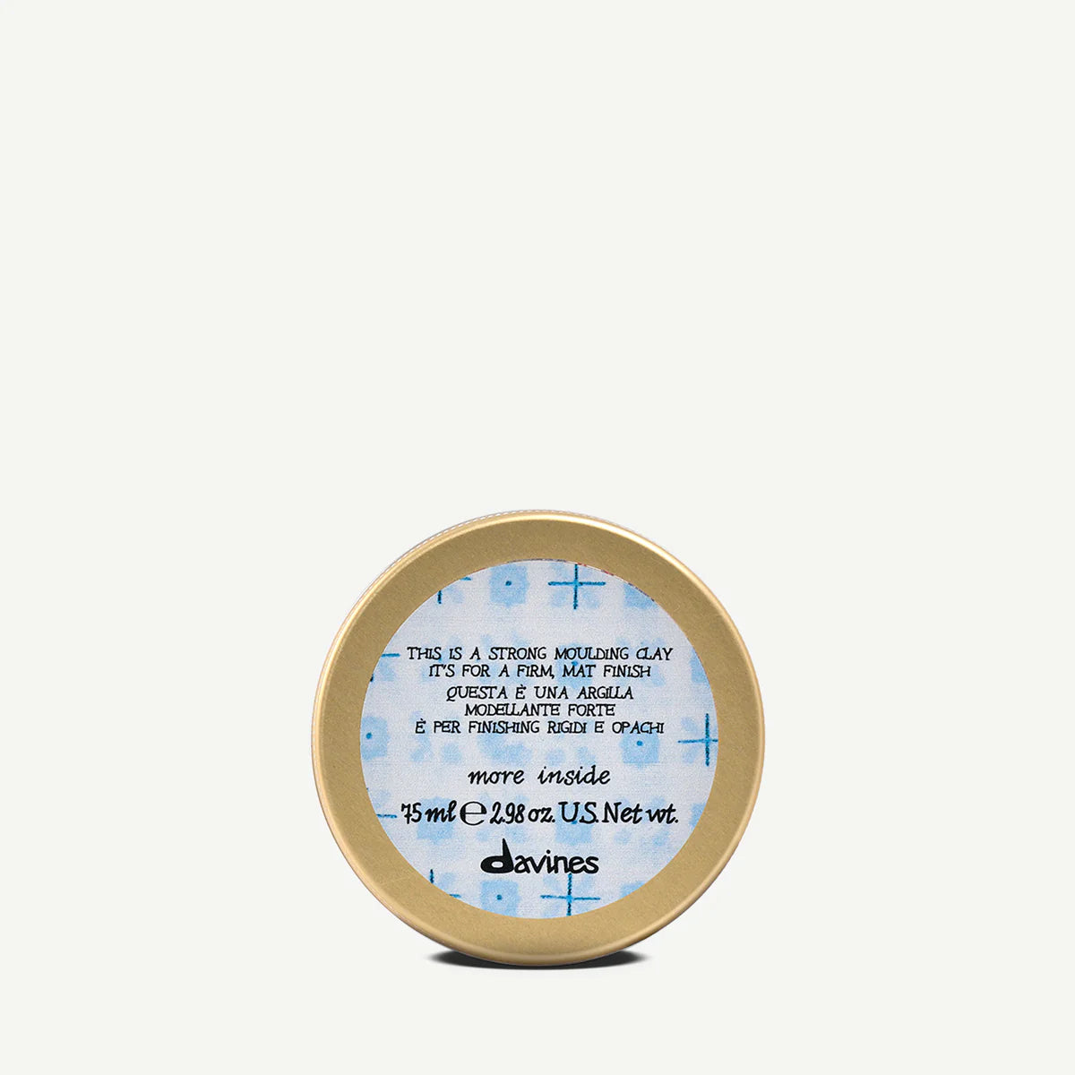 Small gold container with a blue label on a white background