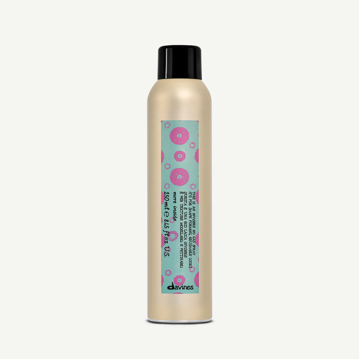 Bottle of Davines Invisible No Gas Spray with a teal and pink label on a white background
