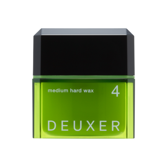 Green container of DEUXER medium hard wax on a white background