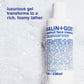 Malin+Goetz grapefruit face cleanser bottle with foamy texture in the background