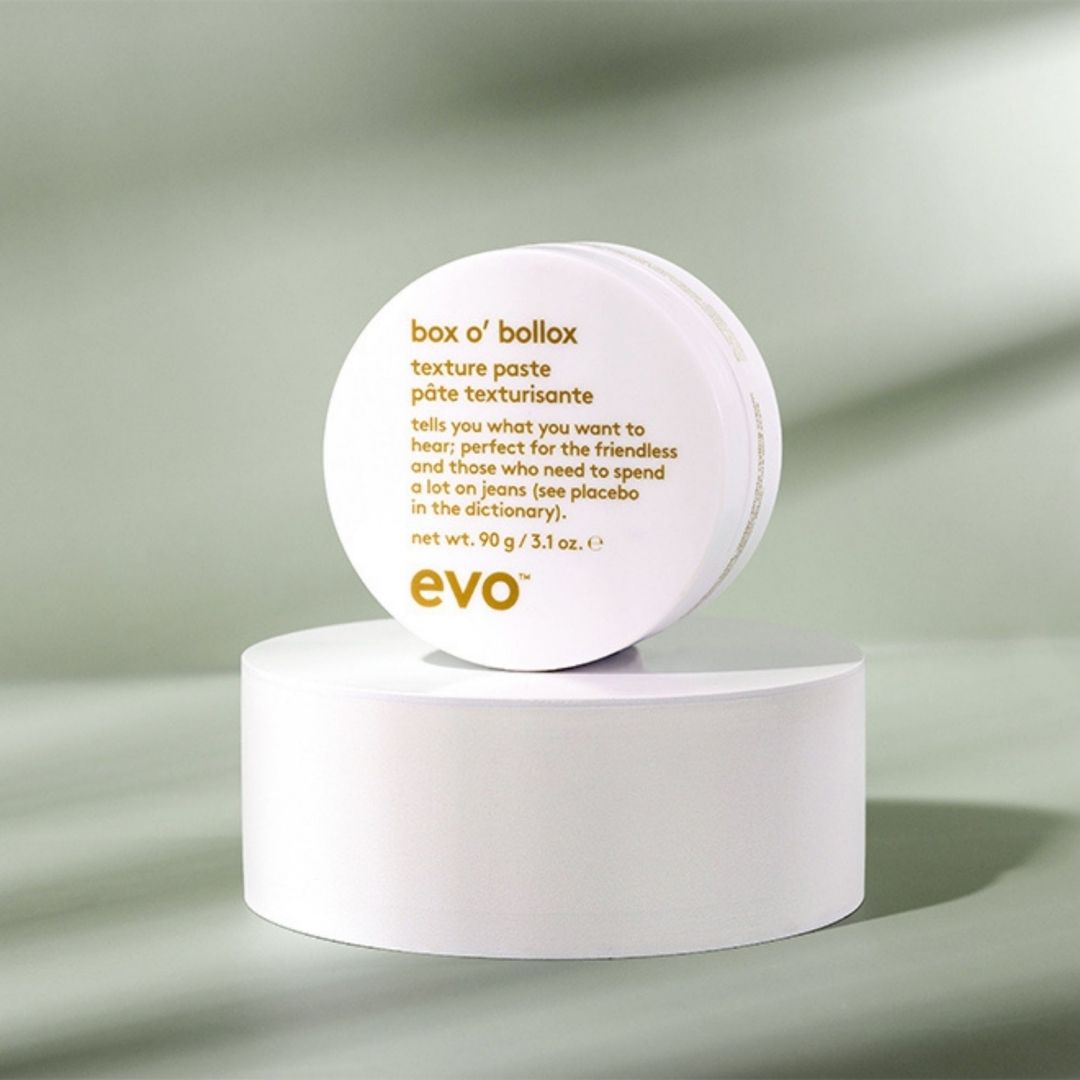 evo box o' bollox texture paste container on a light gray background
