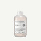 Davines Volu Shampoo with white label on a light grey background