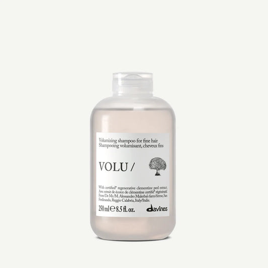 Davines Volu Shampoo with white label on a light grey background