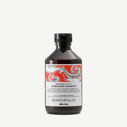 Bottle of Davines Naturaltech Energizing Shampoo on a white background