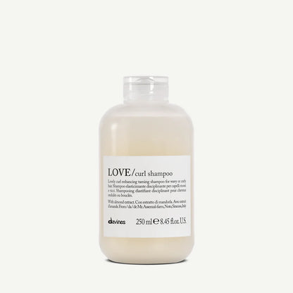 Bottle of Davines LOVE/curl shampoo on a white background