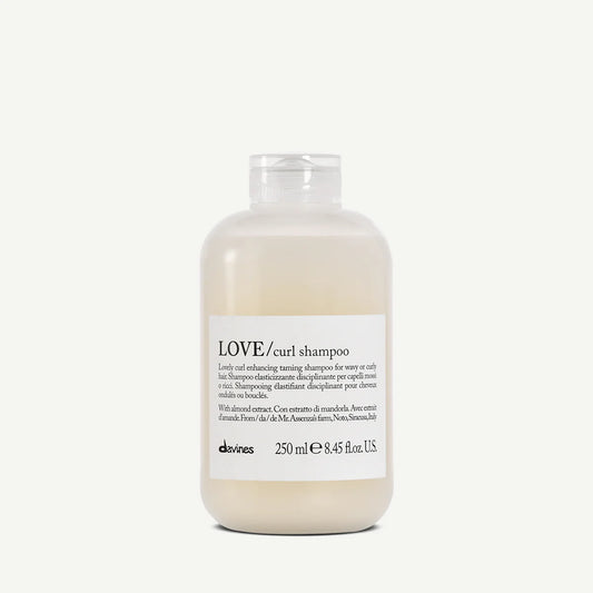 Bottle of Davines LOVE/curl shampoo on a white background
