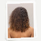 Comparison of damaged curly hair on the left side vs. healthy curly hair on the right side