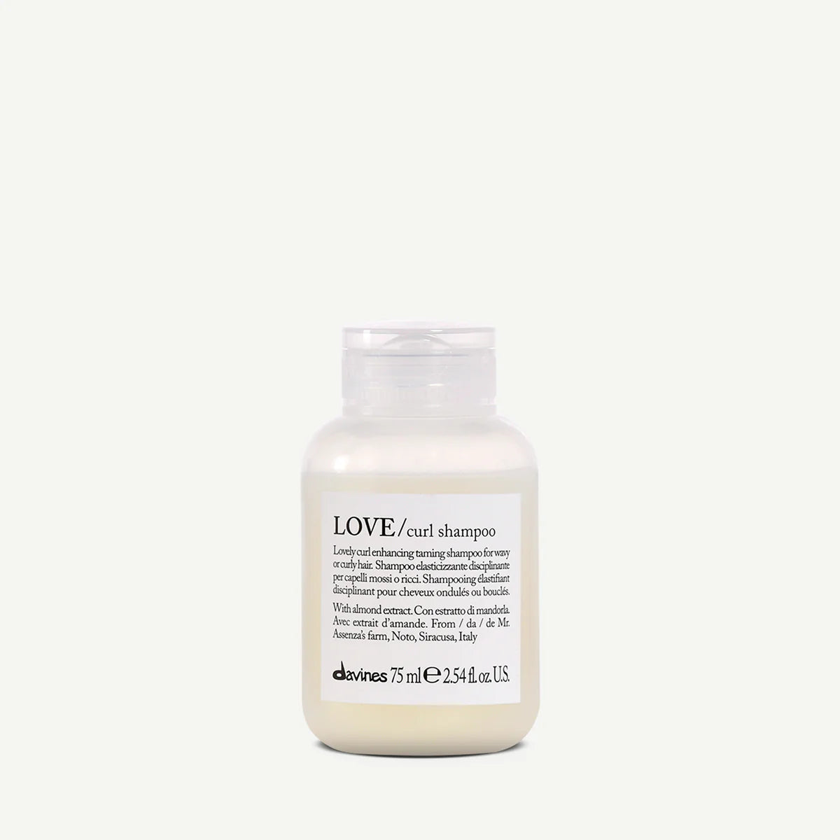 Travel size of Davines LOVE curl shampoo on a white background