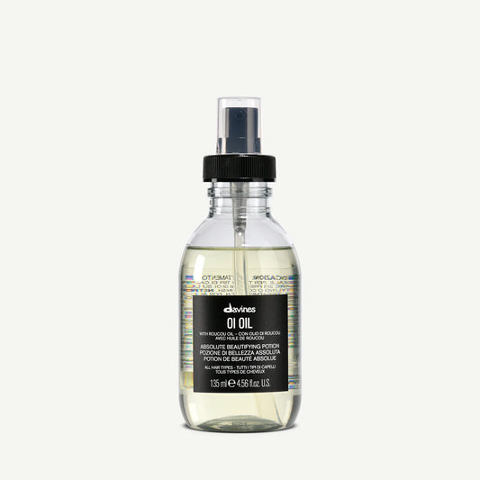 Bottle of Davines OI Oil on a white background