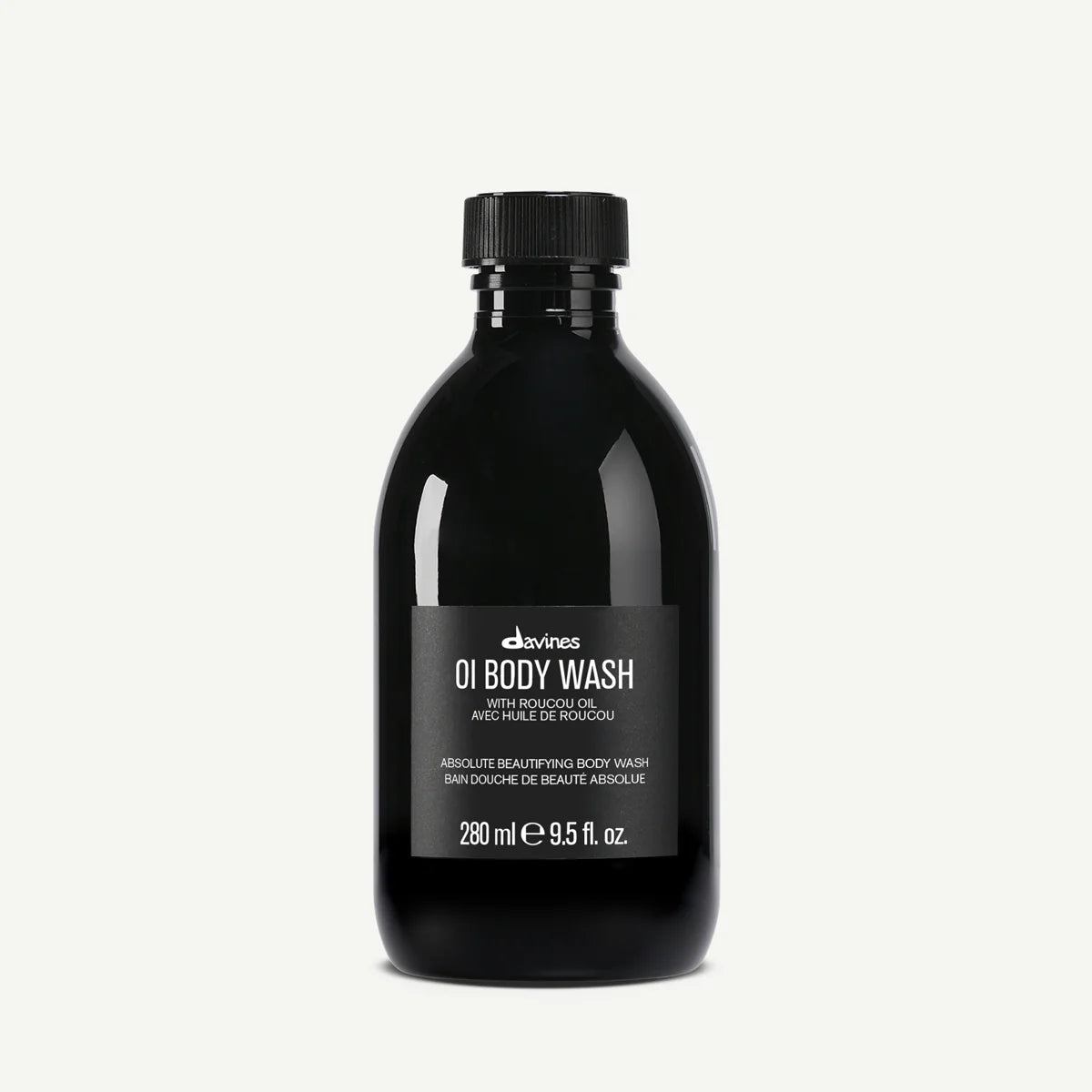 Black bottle of Davines OI Body Wash on a white background