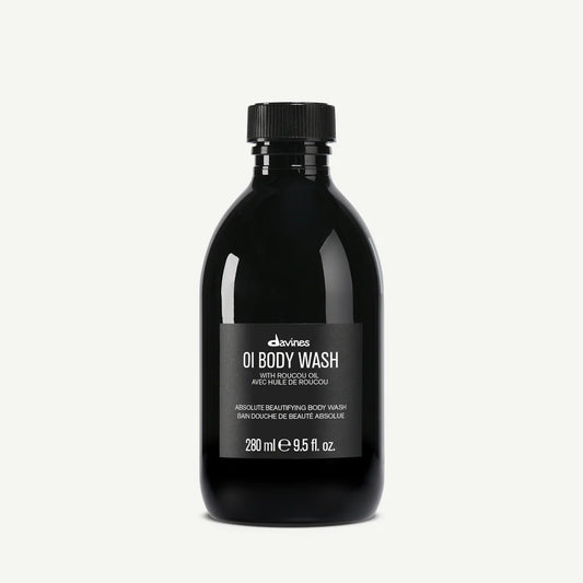 Black bottle of Davines OI Body Wash on a white background