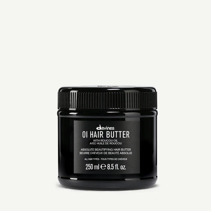 Black jar of Davines OI Hair Butter on a white background