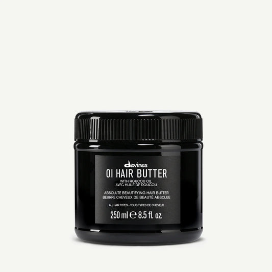 Black jar of Davines OI Hair Butter on a white background