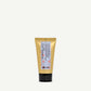 Gold tube with black base on a white background