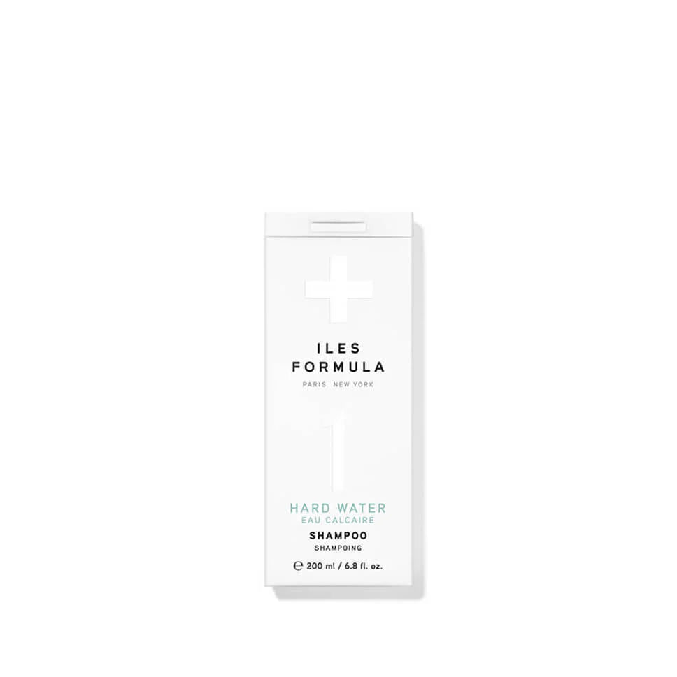Shampoo bottle with 'ILES FORMULA' branding on a white background