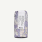 Hair product with floral packaging and 'davines' branding on a white background
