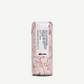 Davines hair product packaging with floral design on a white background