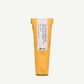 Yellow hair care product tube with a white label on a light gray background