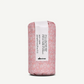 Pink floral-patterned hair product packaging with Davines logo on a white background