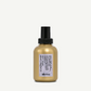 Gold bottle with black cap on a white background