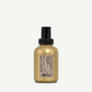 Gold bottle with black cap on a white background