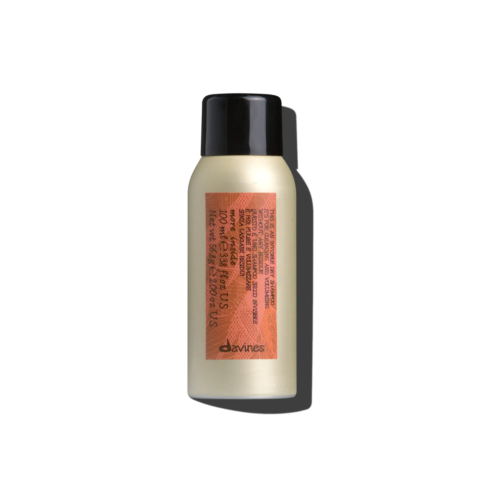 Hair product bottle with black cap and orange label on a white background