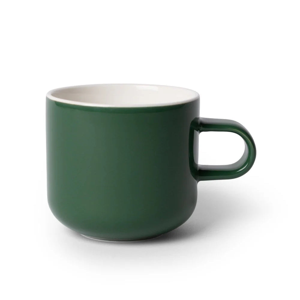 Green mug with white interior on a white background