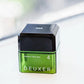 Green container of DEUXER medium hard wax on a white background