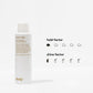 White bottle of dry shampoo with branding and product features on a white background