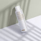 evo water killer dry shampoo bottle on a light surface with a neutral background