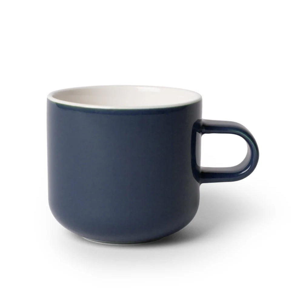 Navy blue mug with a white interior on a white background