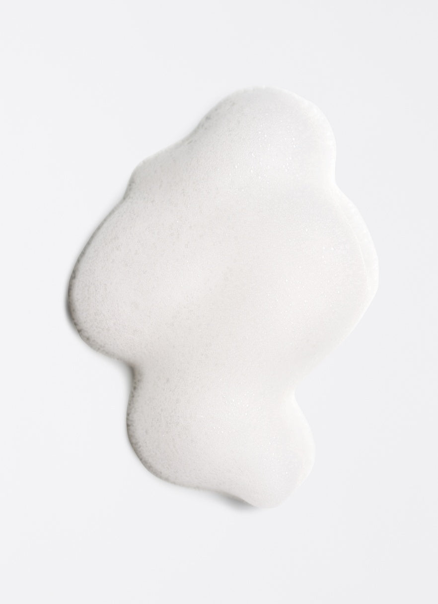 White, bubbly foam on a white background