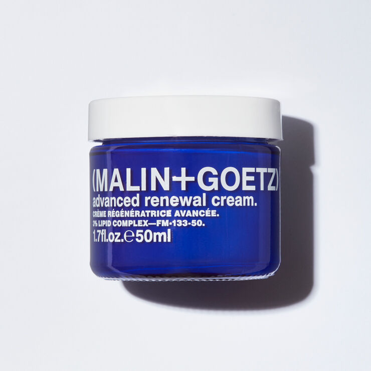 Blue jar of Malin+Goetz advanced renewal cream on a white background
