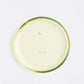 Petri dish of Argan oil on a white background